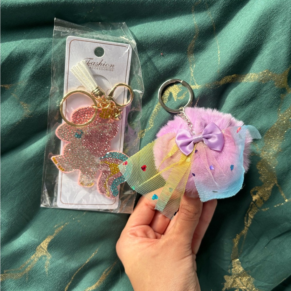 Purple Rainbow Pom Pom Keychain and Rainbow Bedazzled Unicorn Keychain